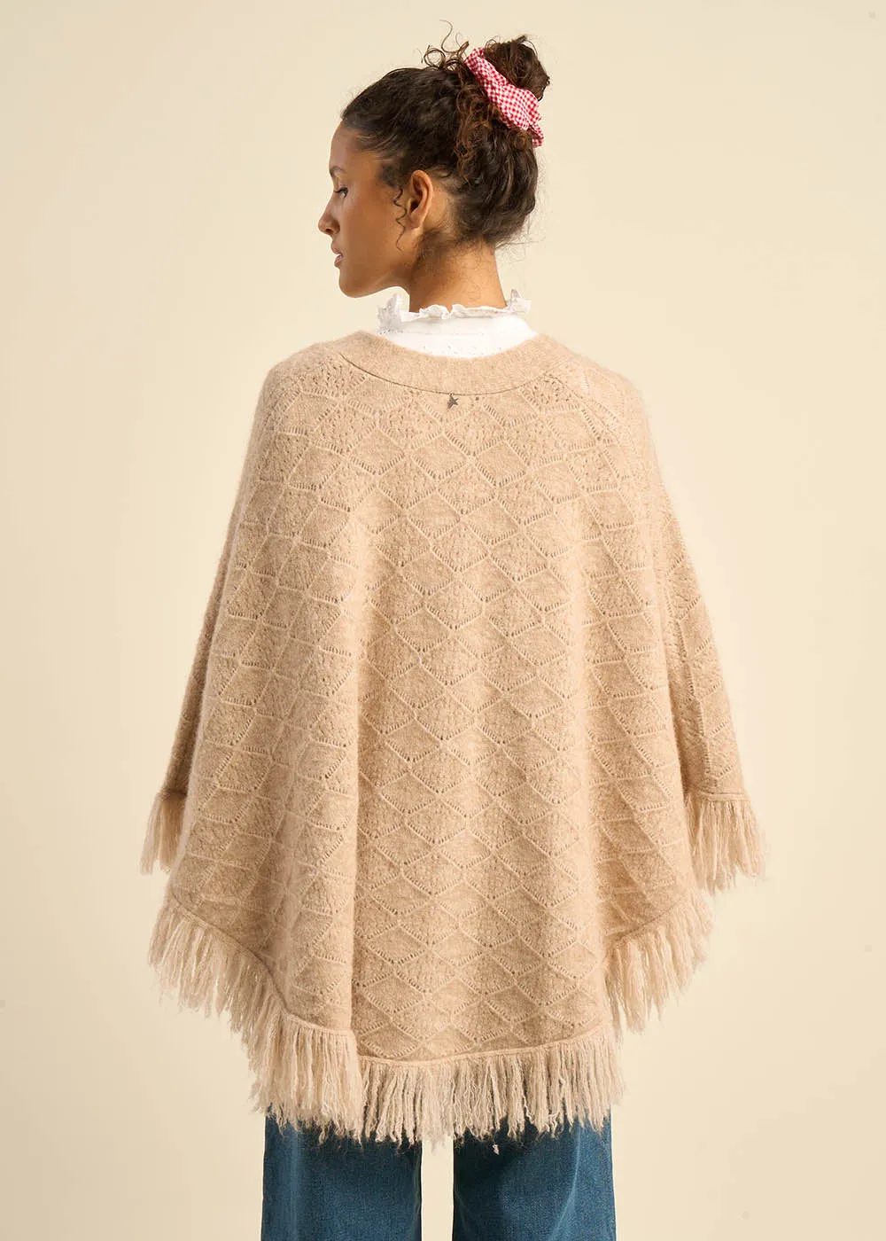 Poncho boutonné à franges